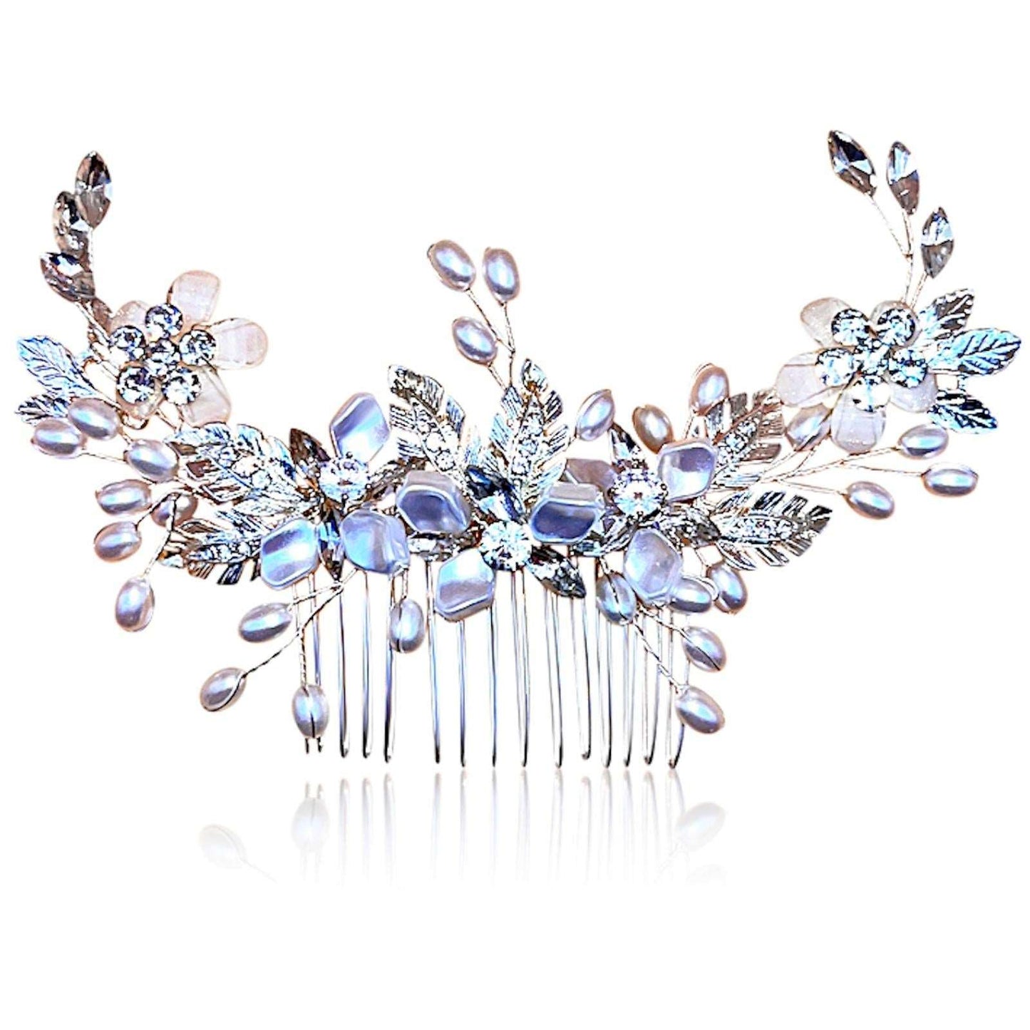 hair combs with pearl rhinestones and silver leaves in an upward display illuminated